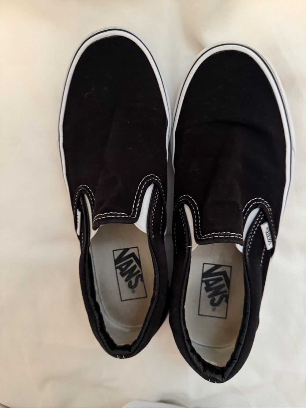 Vans Slip-On Canvas Sneakers in Black and White